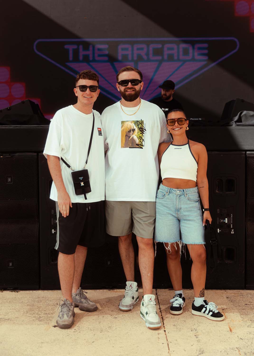 Bass Jamz Gaskin, Ellia Jaya and Lundy infront of big neon sign 'The Arcade' 528 Ibiza 